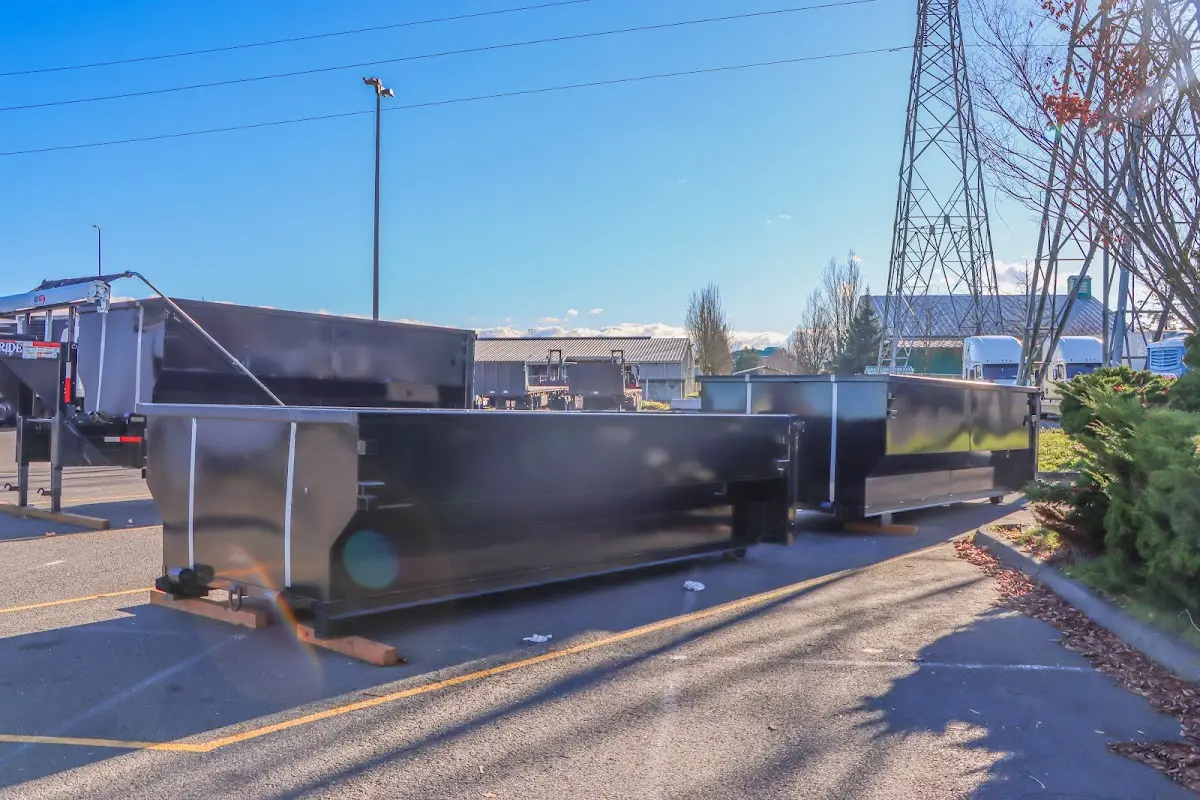 Roll-off dumpster ready for waste disposal at job site for Construction Dumpster Rental in Raymond